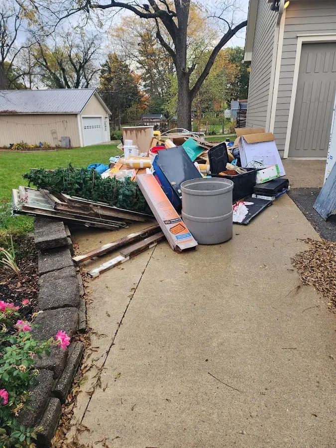 Dumpster being loaded with debris for Demolition Dumpster Rental in West Manchester